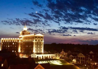 A large building with lights on top of it.