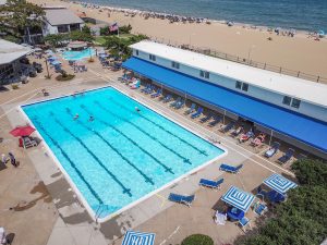 An aerial view of a swimming pool and beach.