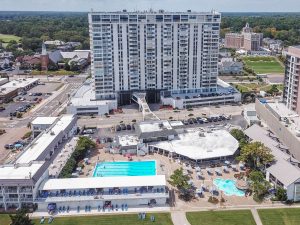 A large building with many pools in the middle of it