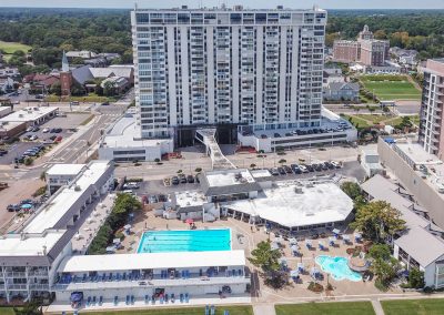 A large building with many pools in the middle of it