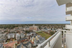 A view of the city from an apartment balcony.