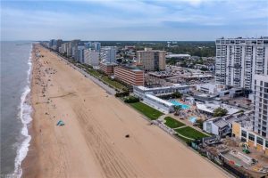 A beach with many buildings and people on it