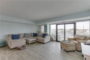 A living room with couches and chairs in it