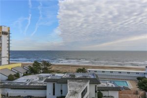 A view of the ocean from an apartment building.