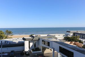 A view of the ocean from an apartment building.