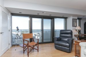 A living room with a chair and a television.